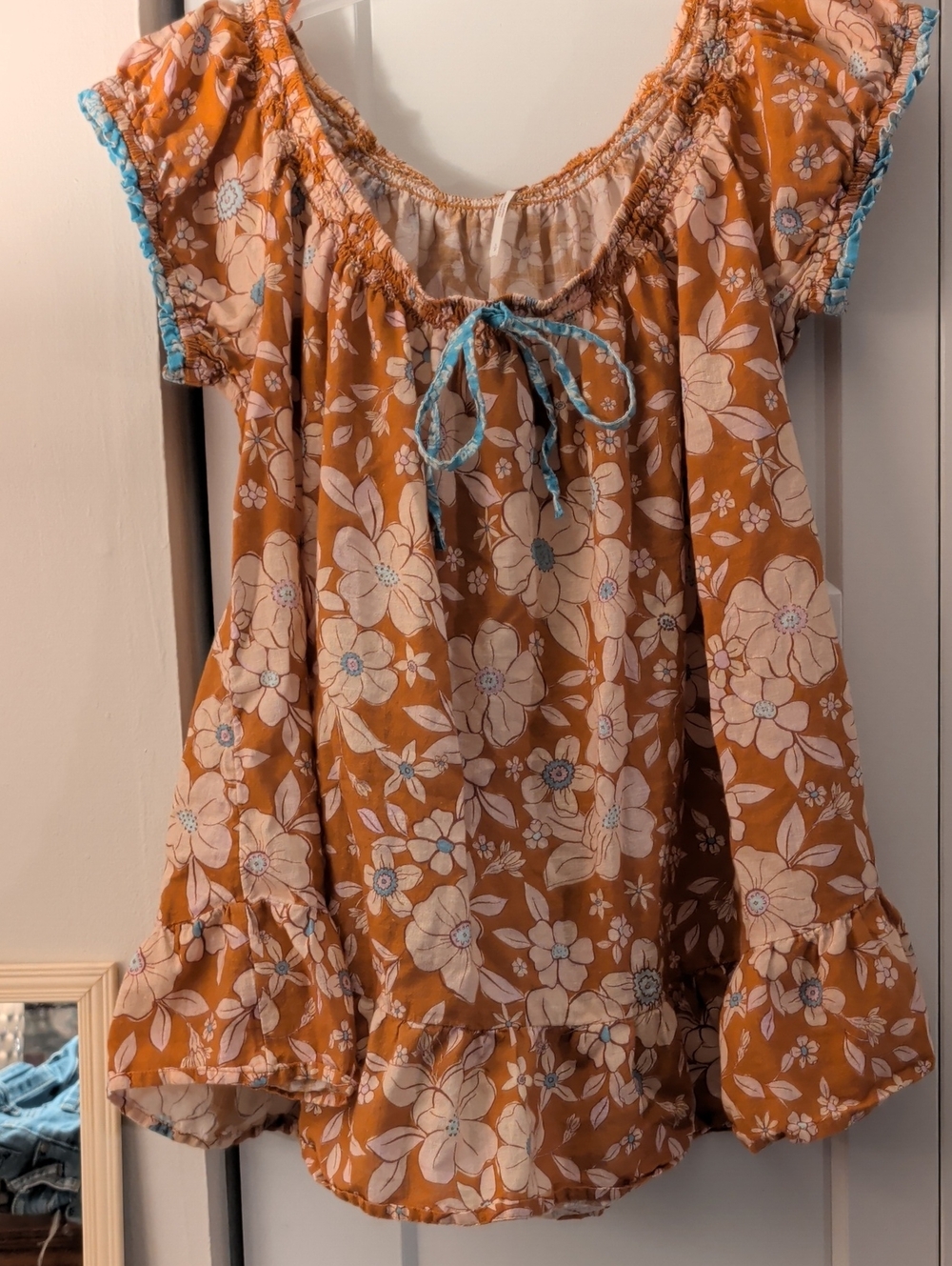 Free People Floral Peasant Top in Rust Orange with Blue Trim
